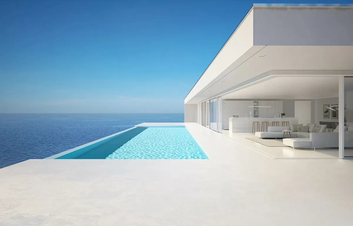 A white modernist pavilion with an infinity pool