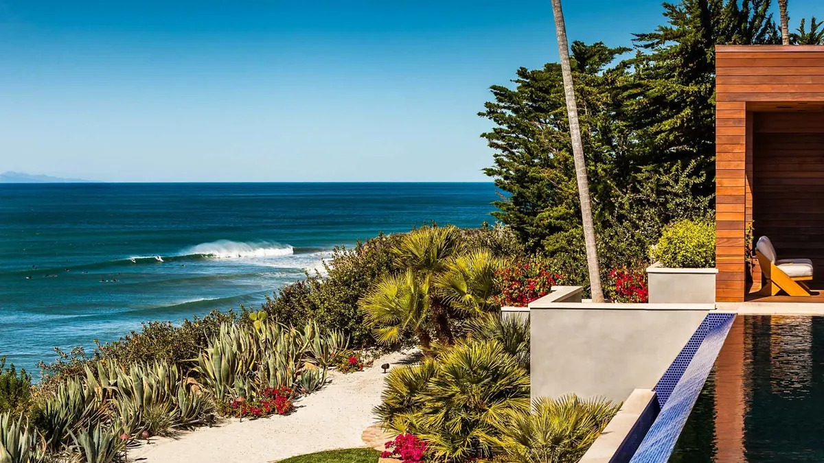 A cliffside garden and pool above the surf