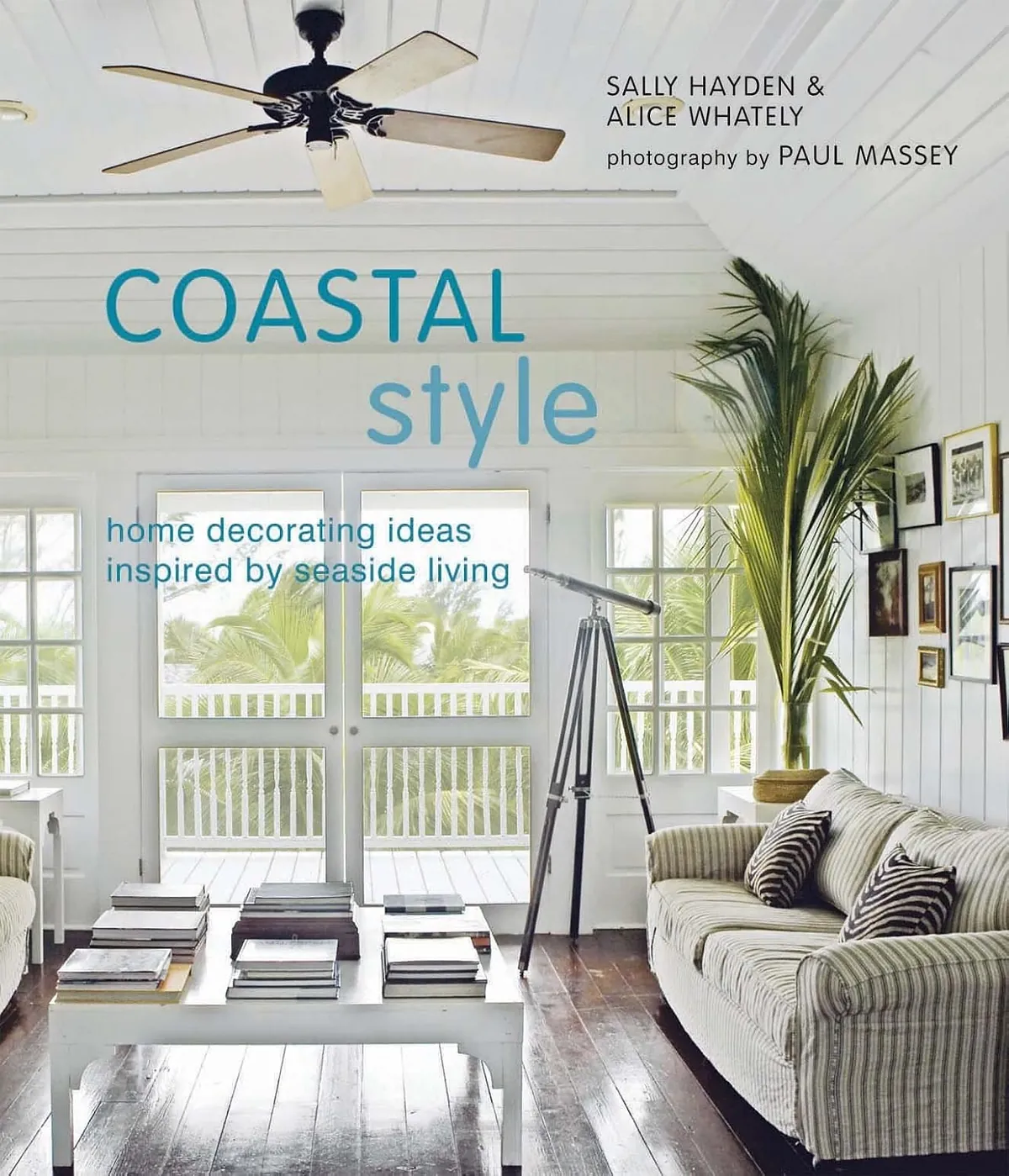 Alter your course and enjoy this Coastal Style book with a view of palm trees and a living room with art